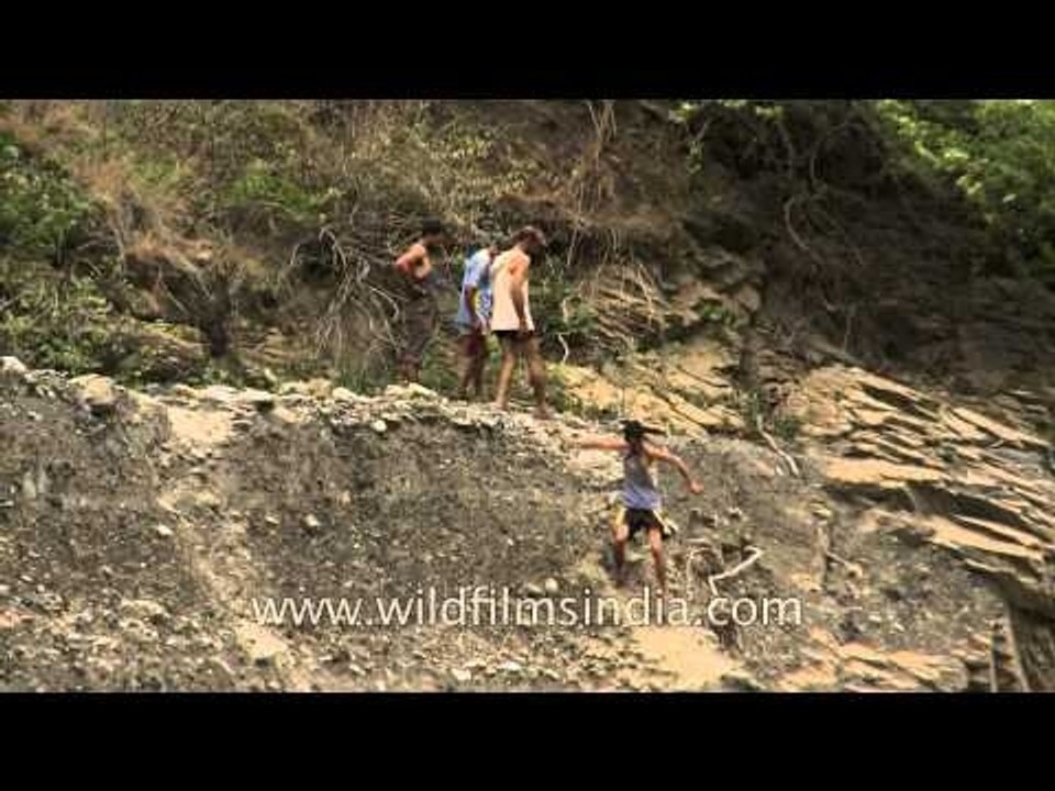 People walk down to Aglar river to celebrate Maund Mela