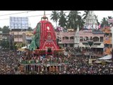 Volunteers carry unconscious devotee during Jagannath Rath Yatra, Puri