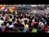 Volunteers spray water on devotees at Jagannath Rath Yatra, Puri