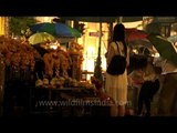 Thai women praying at Erawan - a Hindu shrine in Bangkok, Thailand