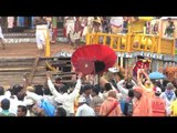 Devotees gather near huge, colourfully decorated chariots in Puri