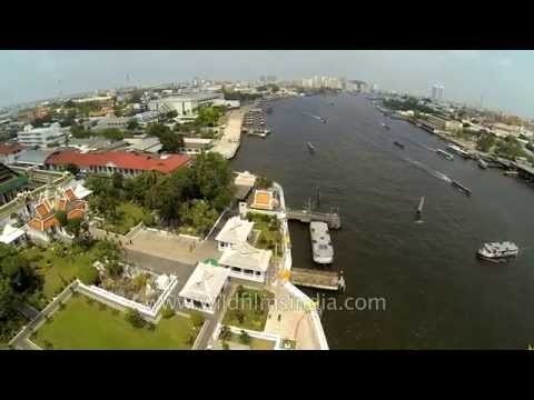 Aerial shots of Wat Arun Temple and Chao Phraya River - Thailand