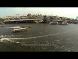 Express boats ferry passengers along Chao Phraya River : aerial footage
