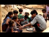 Children outside their mud house at a village in Madhya Pradesh