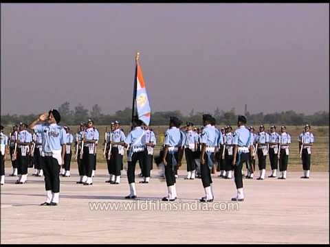 Indian Air Force (IAF) officers march with IAF flag