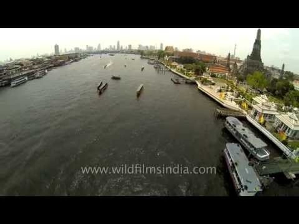 Fly over Temple of Dawn Wat Arun and Chao Phraya in Bangkok