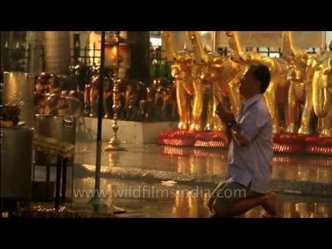 People praying and paying obeisance at the Erawan shrine - Bangkok