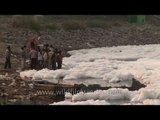 Industrial foam and riverine pollution wells up in Yamuna river near Delhi