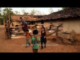Children playing outside their mud house in Panna, MP