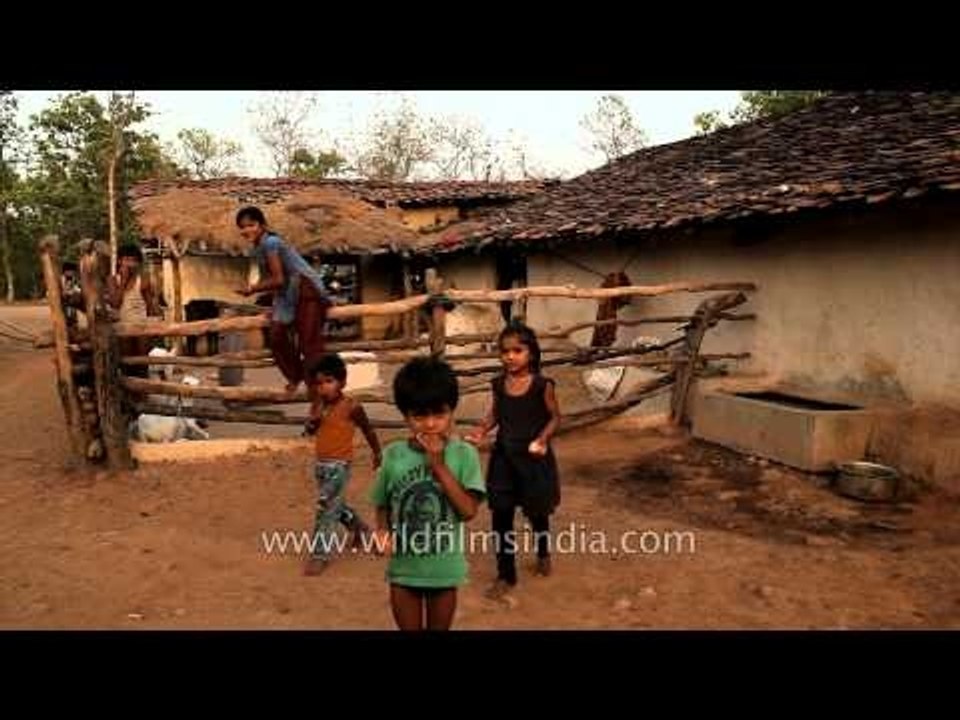 Children playing outside their mud house in Panna, MP