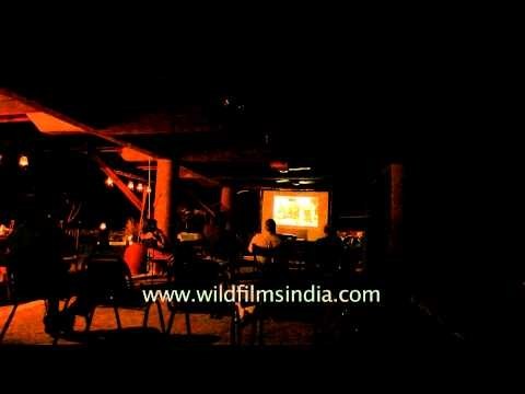 Guest watching a documentary movie at Ken River Lodge