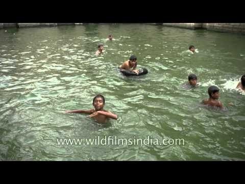Local divers at the sacred Nizamuddin Baoli, Delhi