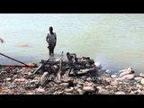 Post-cremation work along the banks of Ganga river