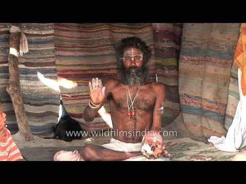 Aghori sadhu applying human ash