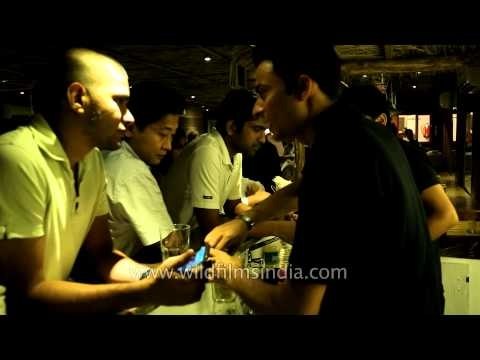 Bartenders serving drinks to visitors at Dzukou restaurant