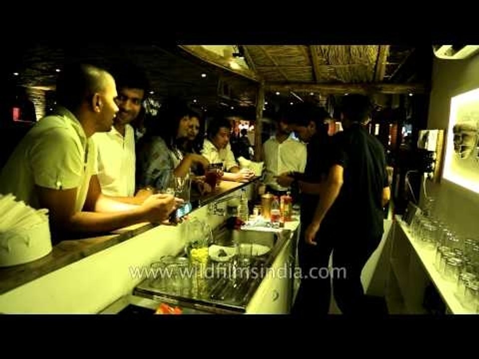 Bartenders at Dzukou restaurant serving beer