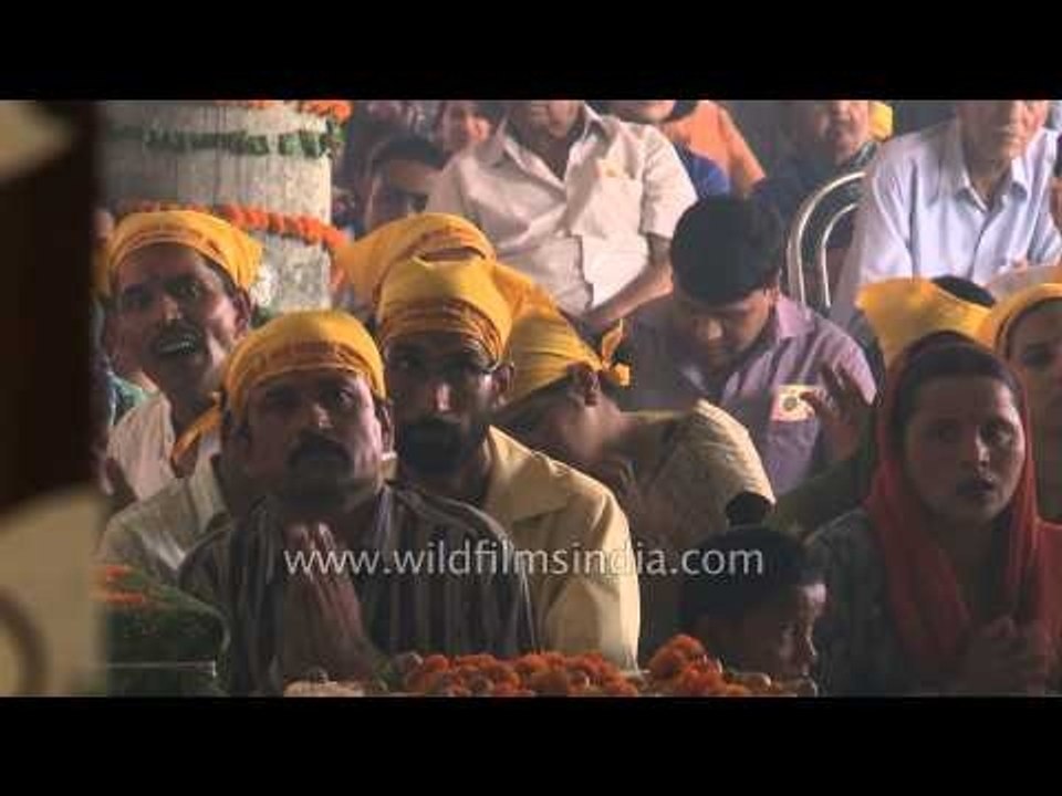 Priest performing Sai Baba's aarti at Saisthanam temple - Dehradun