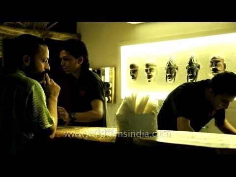 Bartender pouring drinks for visitors at Dzukou restaurant