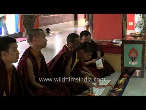 Monks of Mindrolling Monastery gather for evening prayer