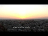 A golden sunrise over the blue houses of Jodhpur