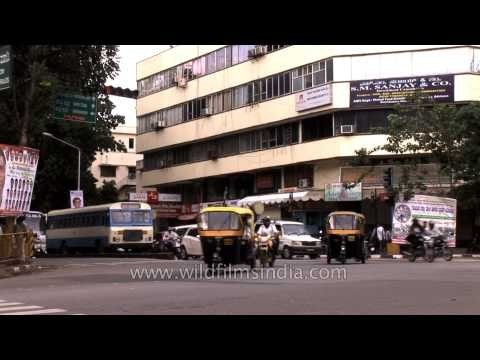 Auto rickshaws, motorbikes, cars fill Bangalore streets