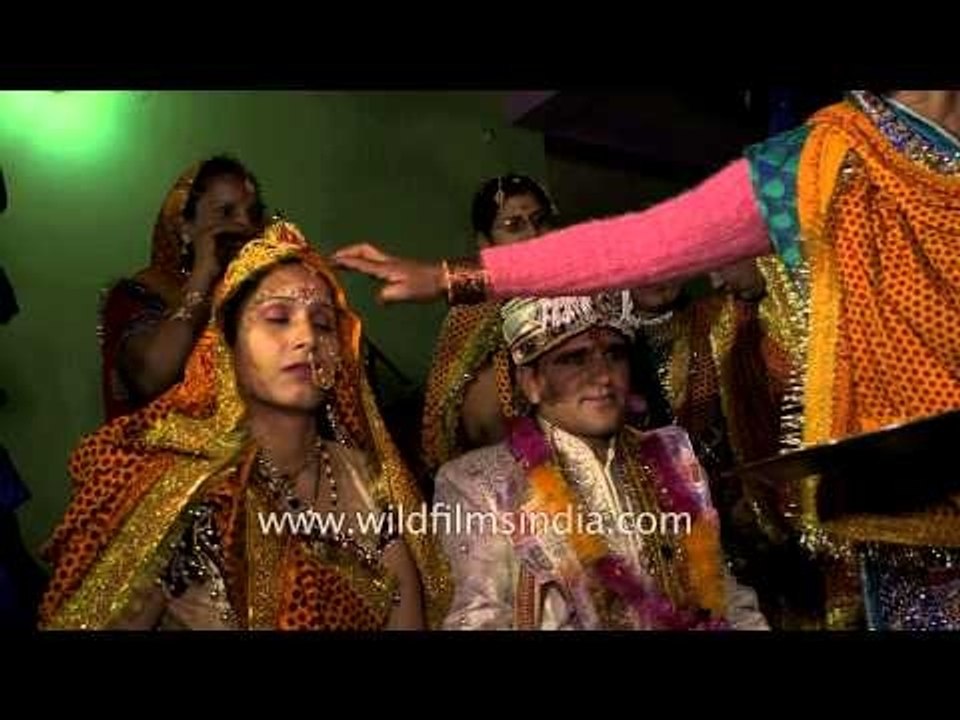 Relatives of bride and groom blessing the couple