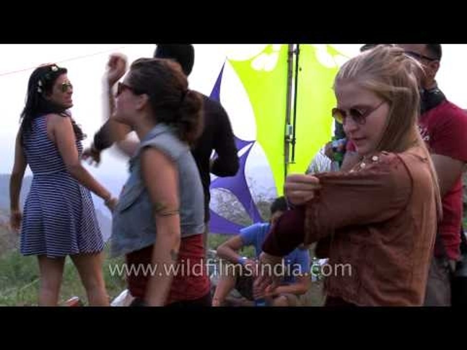 Indian and foreign attendees alike dance to DJ Mash's turntable skills