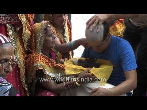 Kumaoni groom's brother getting his head shaved