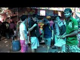 Youngsters choosing shoes at Daryaganj market