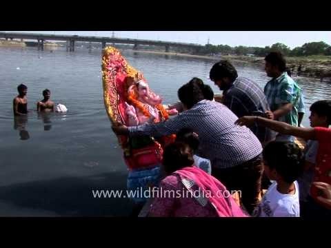Devotees gathered to immerse statues of elephant-headed Hindu God Ganesha