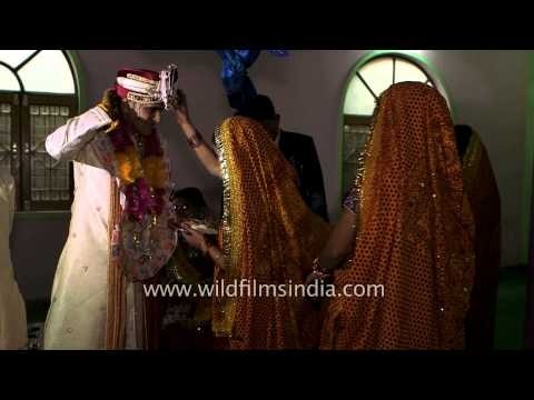 Bride's relatives welcoming the groom