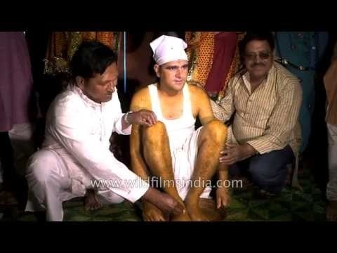 Relatives applying 'haldi' to the groom - Kumaoni wedding