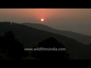 Sun setting behind hills: Uttarakhand