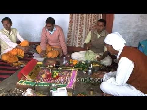 Groom's father performing 'havan' rituals before wedding