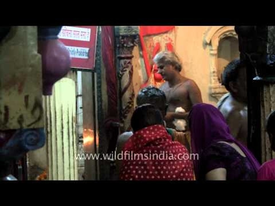 Hindu priest performing the Aarti rituals in Varanasi