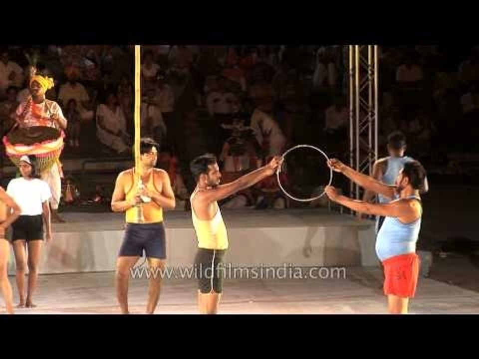 Mallakhamb team performing Hoop diving