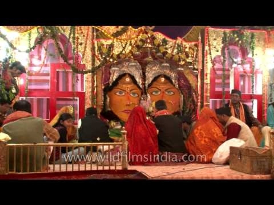 Devotees worshipping Goddesses Nanda and Sunanda
