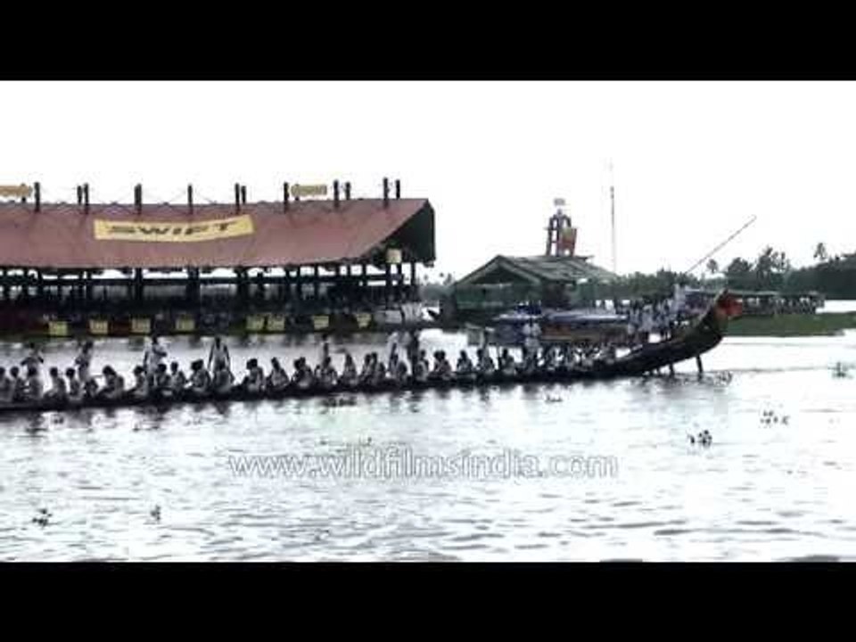 Oarsmen row boat during the Nehru Trophy Boat Race in Alleppey