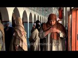 Muslim devotees perform prayers at Makhdoom Sahib Shrine