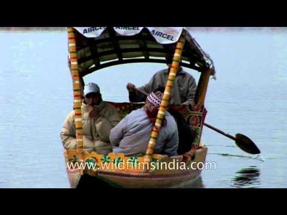 Tourists enjoy a shikara ride on Dal Lake, Srinagar