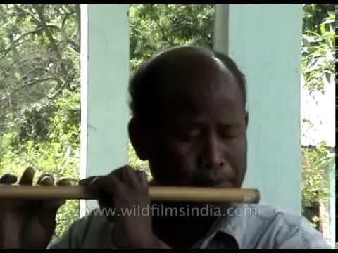Assamese flautist plays traditional bamboo flute