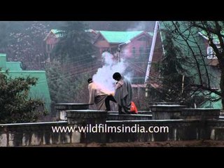 Kashmiri man goes up in smoke! Warming up with a kangri