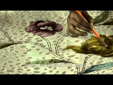 Artisans making intricate motifs on a Banarasi silk saree