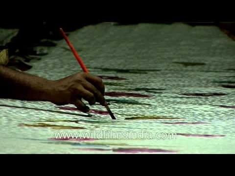 Artisans crafting colorful motifs on Banarasi silk saree