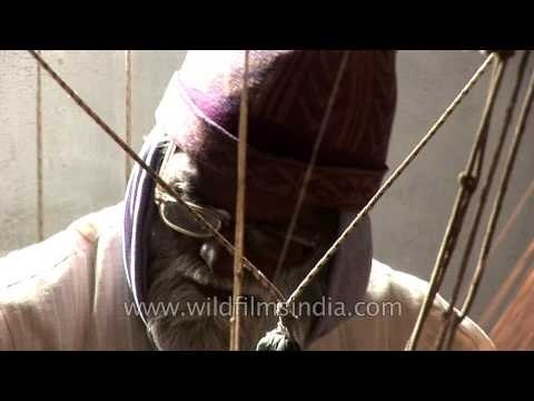An old hand loom weaver making a Banarasi sari in Varanasi