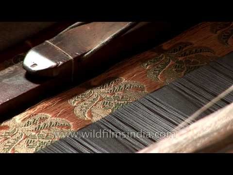 Artisan weaves a Banarasi saree using a traditional weaving machine