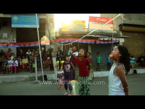 Manipuri children enjoying orange eating competition