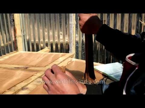Incense sticks drying on wooden planks in Bhutan