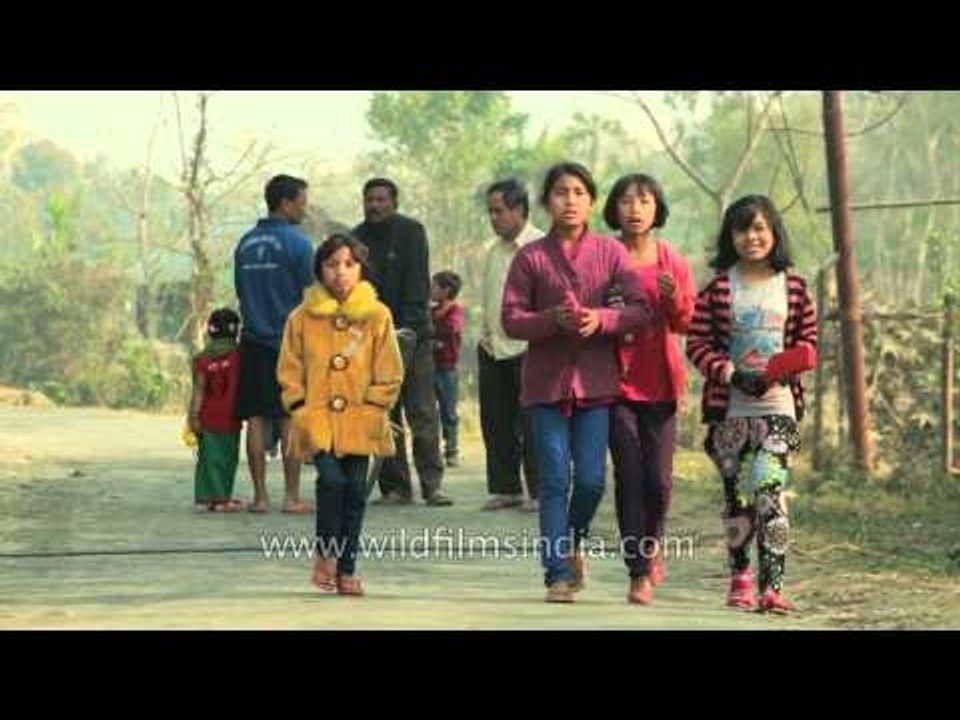 Children returns after collecting rice and vegetables from the neighbourhood