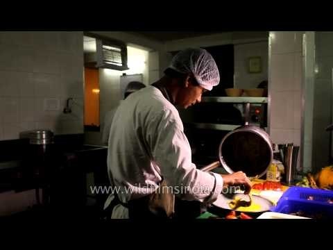 Chef preparing barbeque at a Denwa Backwater Escape lodge